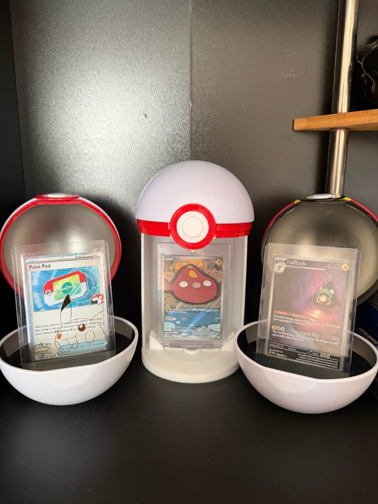 Poké Ball card displays, with Stunfisk held in the center stand