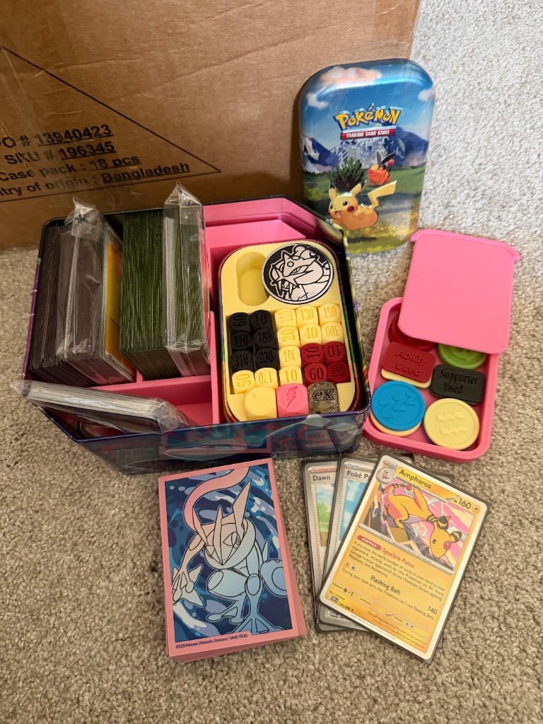 Parallelogram battle tin with two card decks, damage counters, and status tokens